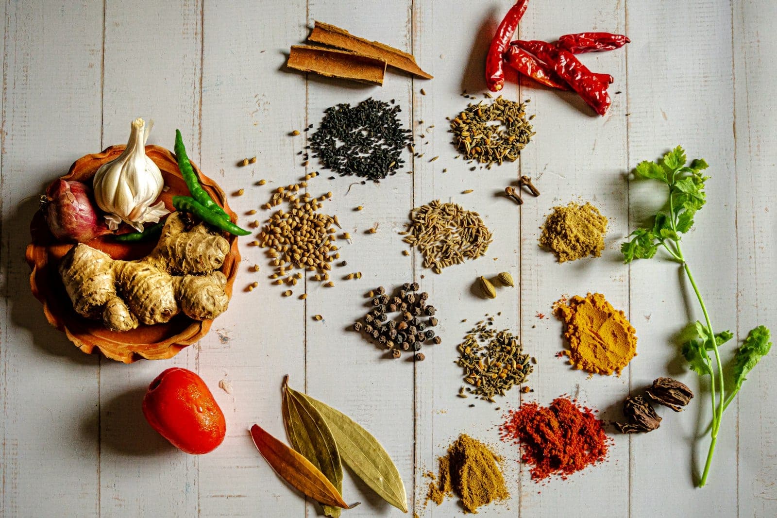 Indian spice range including dried chilli, turmeric, cumin, coriander and pepper